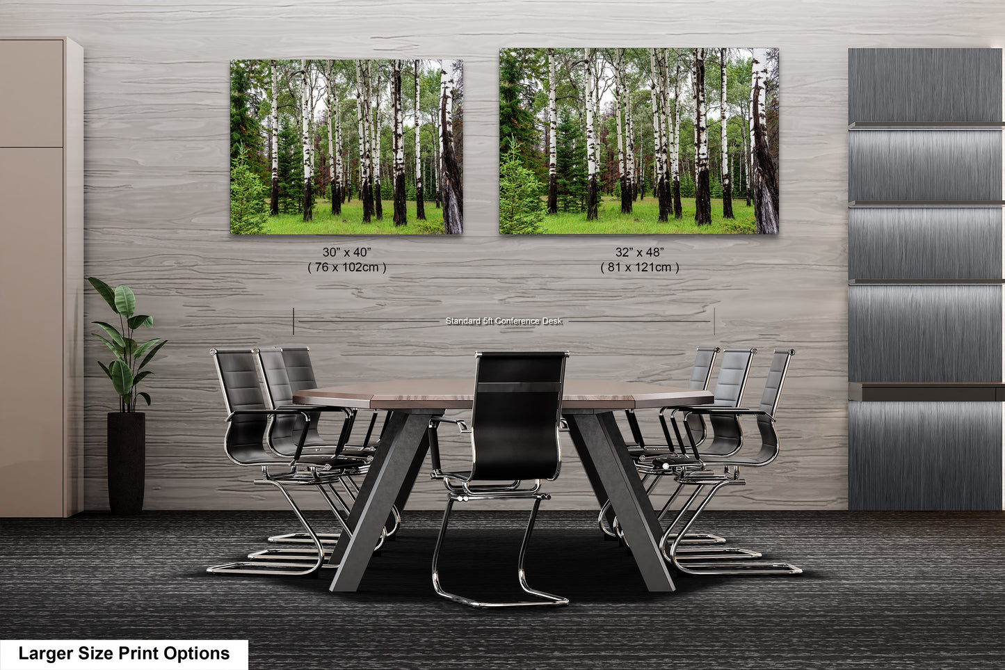 a dining room table with chairs and two pictures of trees on the wall