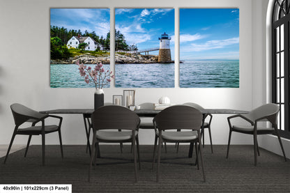 a dining room table with four chairs and a lighthouse