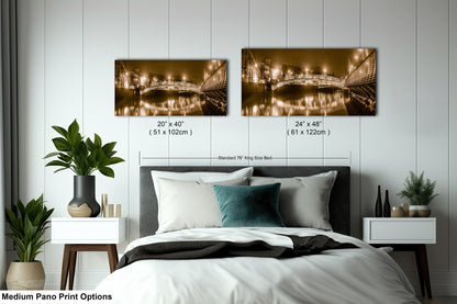 a bed room with a neatly made bed and two pictures on the wall