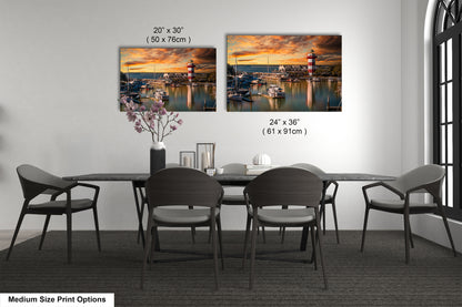 a dining table with four chairs and a vase of flowers