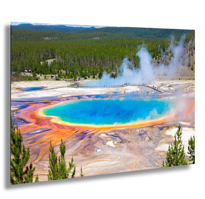 a large blue crater surrounded by a forest