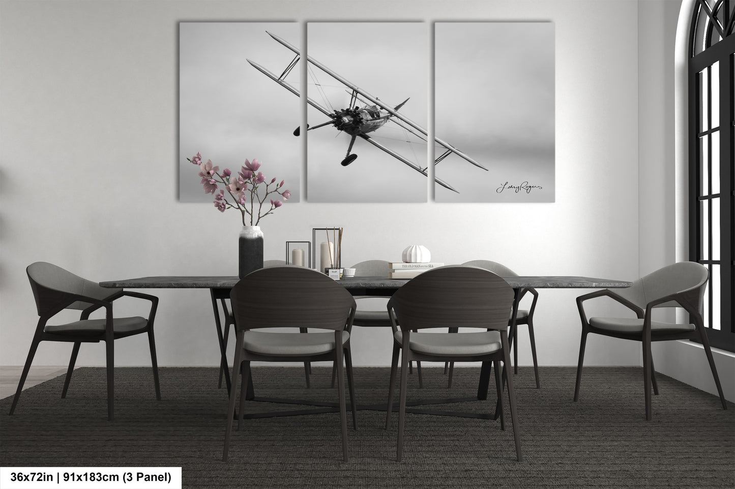 a black and white photo of a dining room table