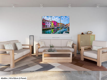 a living room filled with furniture and a painting on the wall