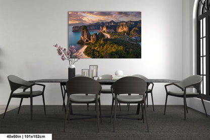 a dining room table with chairs and a painting on the wall