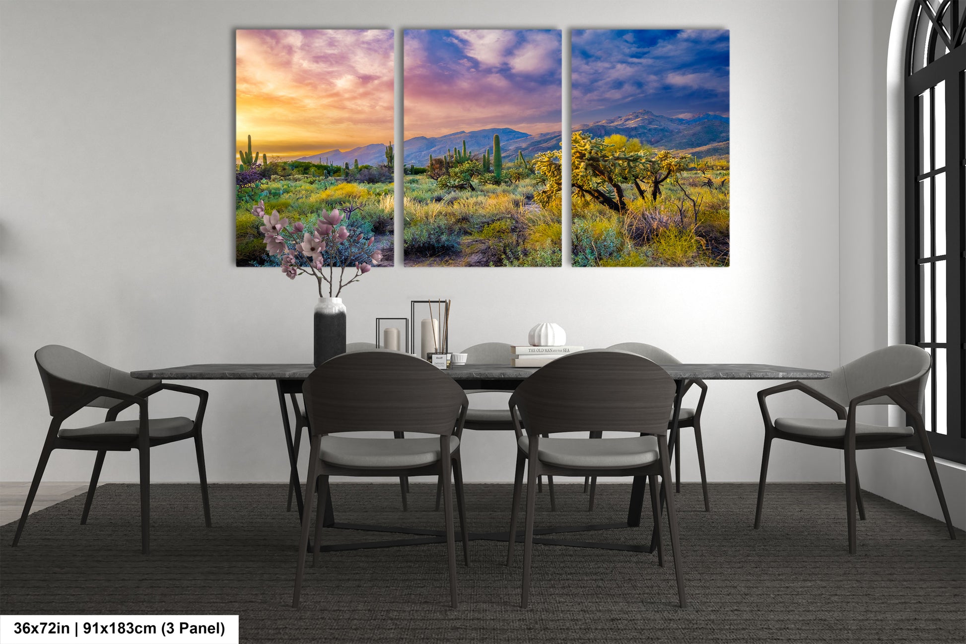 a dining room table with chairs and a painting on the wall