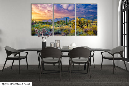 a dining room table with chairs and a painting on the wall