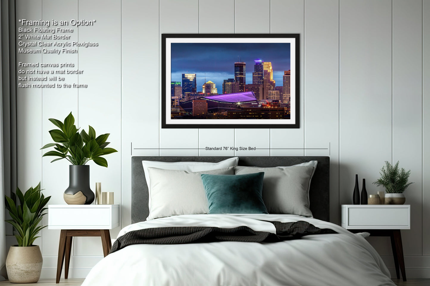 a bedroom with a bed and a picture hanging above it