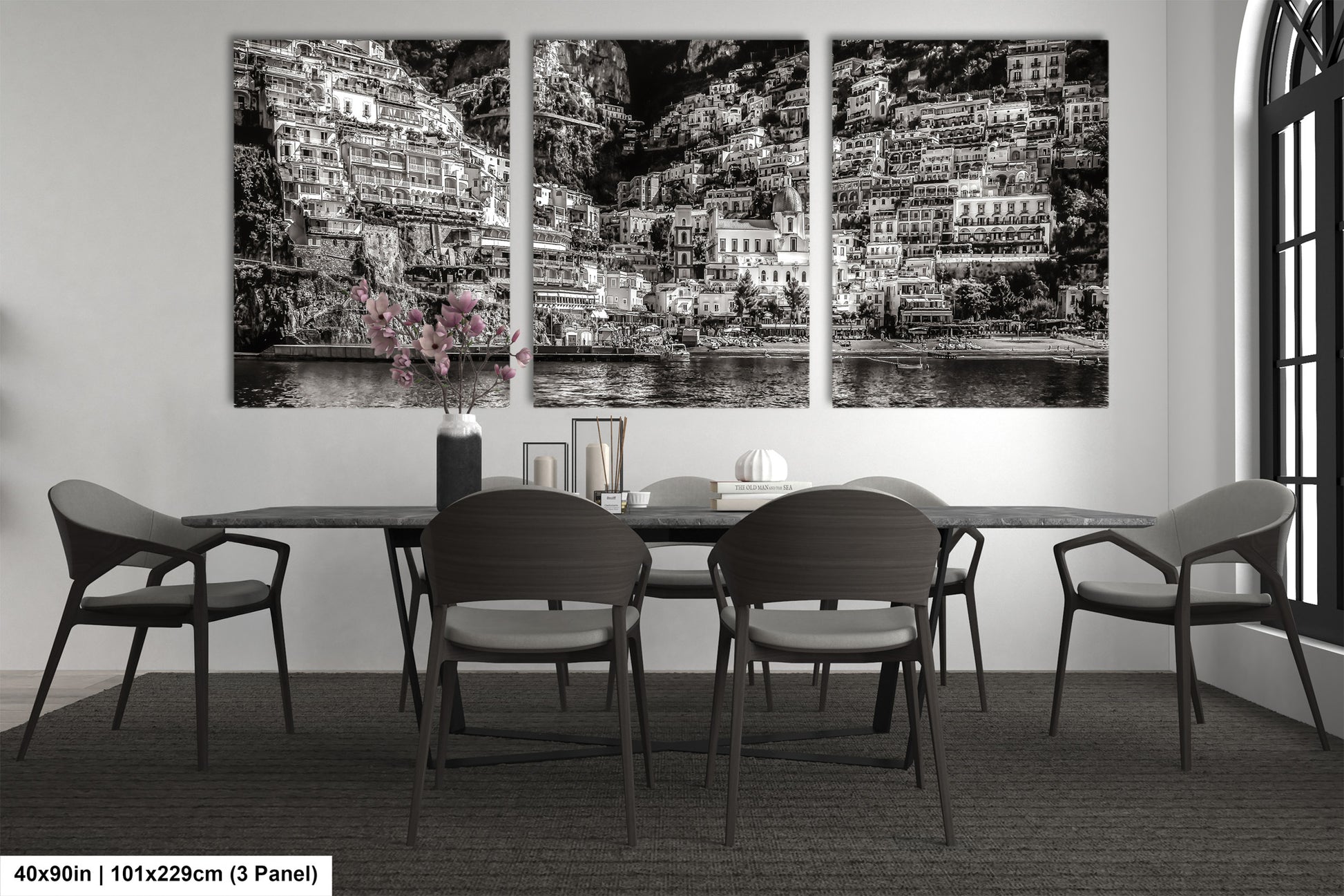 a black and white photo of a dining room