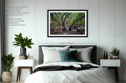 a bedroom with a bed and a picture hanging on the wall