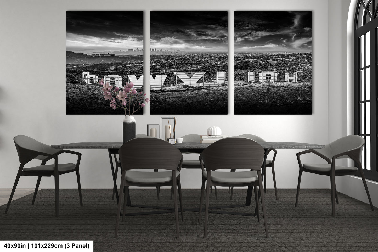 a black and white photo of a dining room table