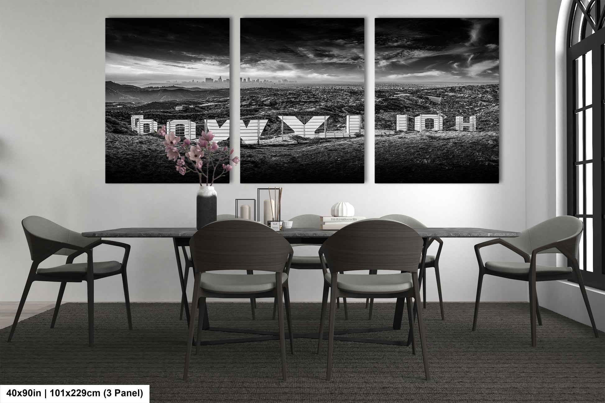 a black and white photo of a dining room table