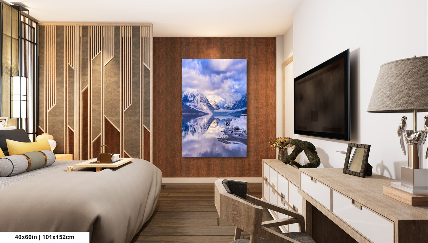 a bed room with a neatly made bed and a flat screen tv