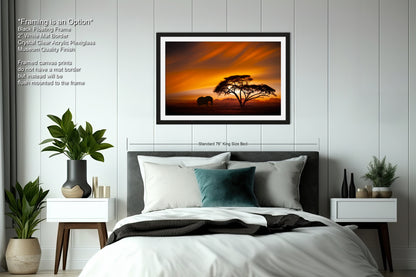a bedroom with a bed and a picture on the wall