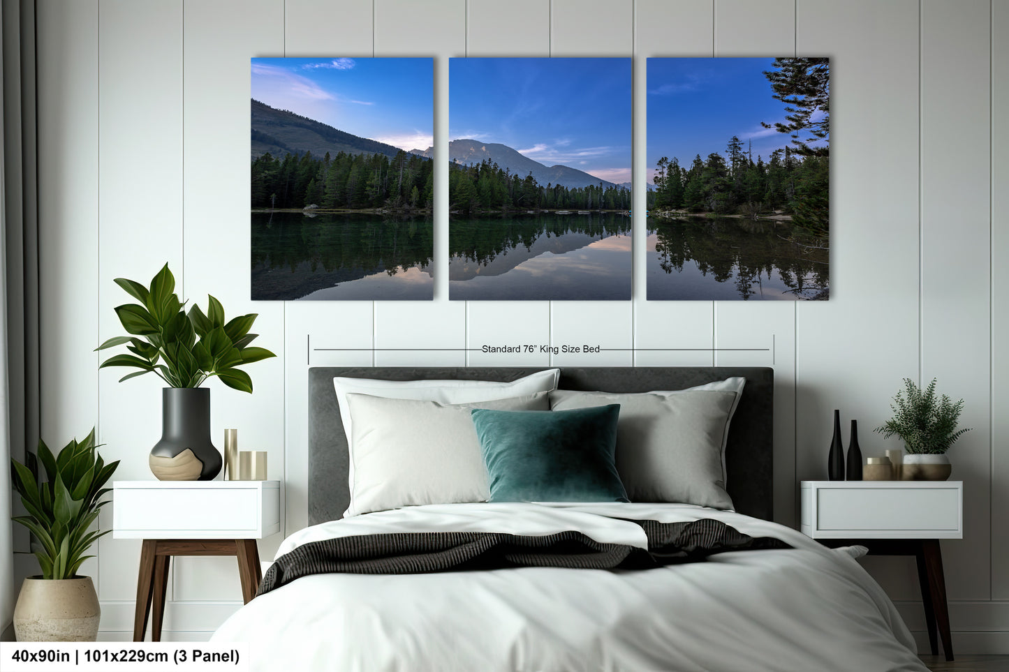 a bedroom with a large bed and three paintings on the wall