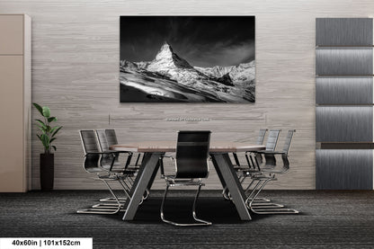 a black and white photo of a table and chairs