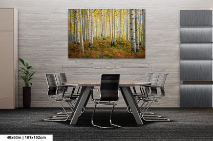 a dining room table with chairs and a painting on the wall