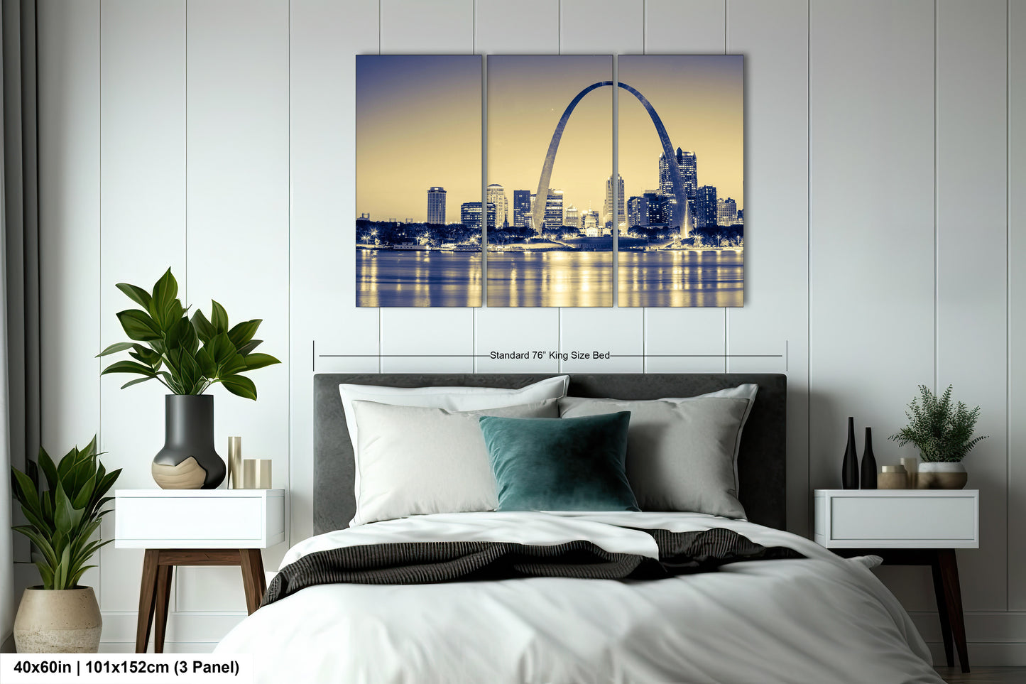 a bedroom with a large bed and a picture of the st louis skyline