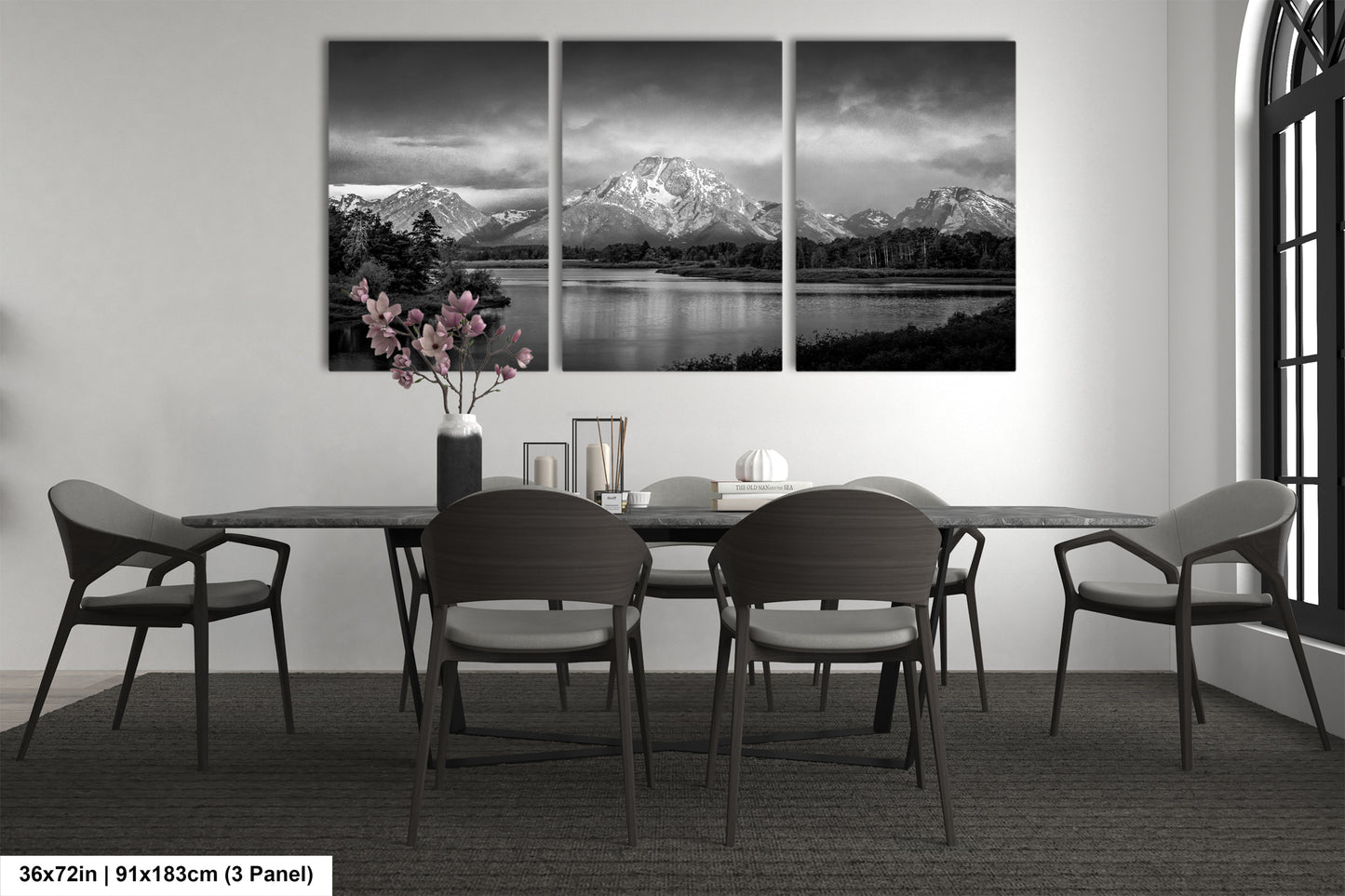 a black and white photo of a dining room table