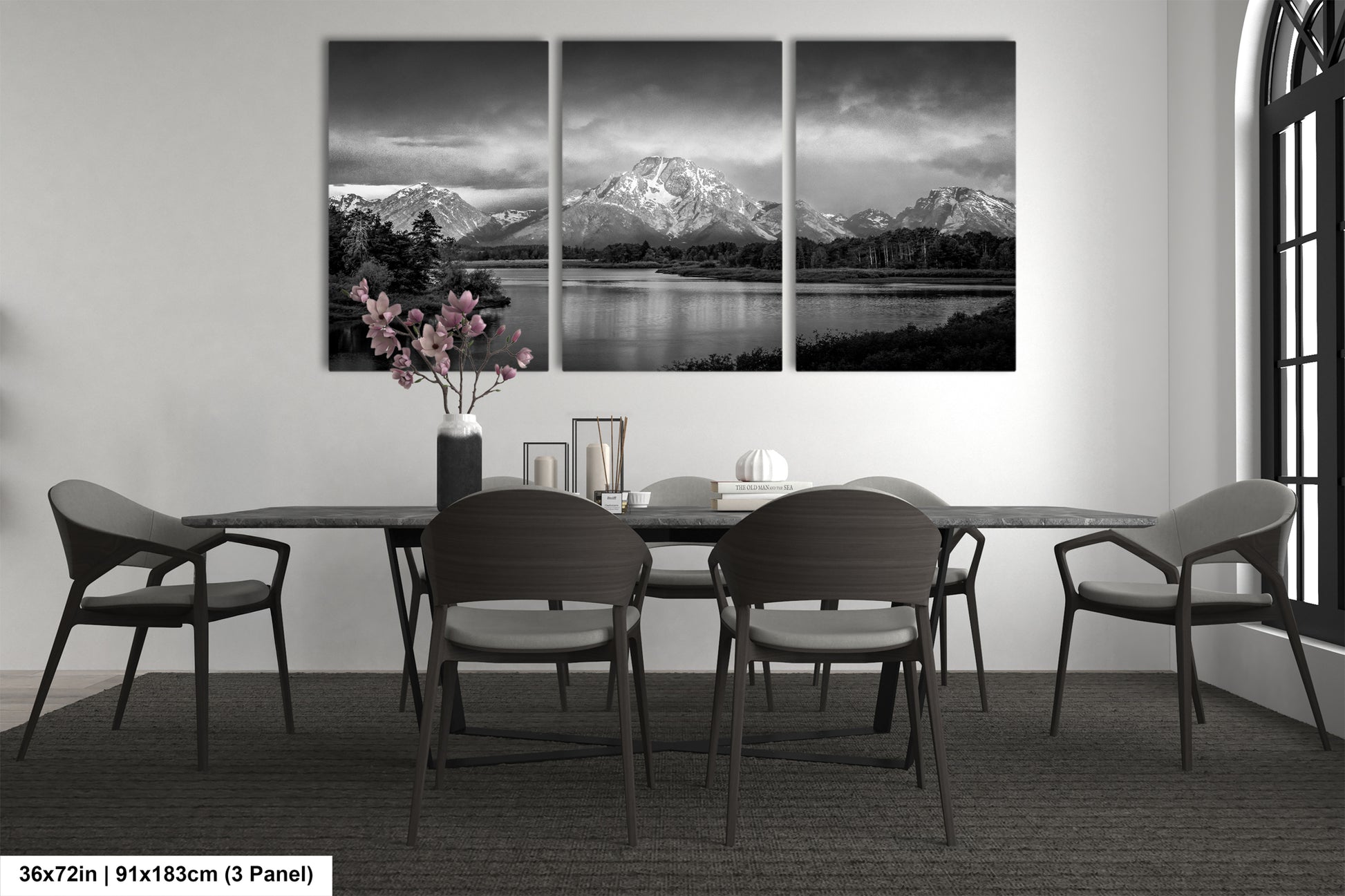 a black and white photo of a dining room table