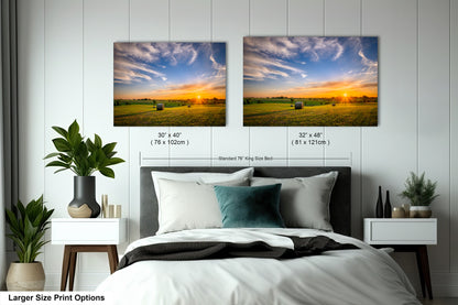 a bedroom with a bed and two pictures on the wall
