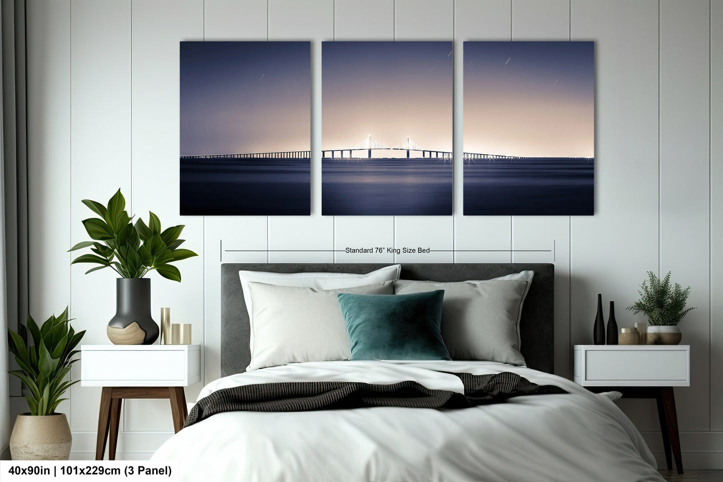 a bedroom with a bed and three paintings on the wall