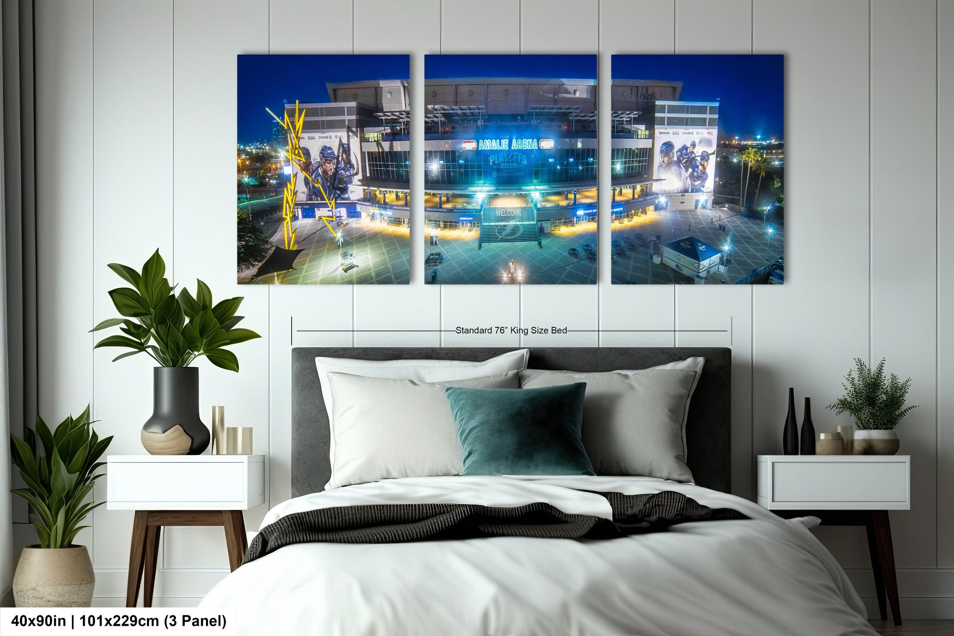 a bed room with a neatly made bed and three paintings on the wall