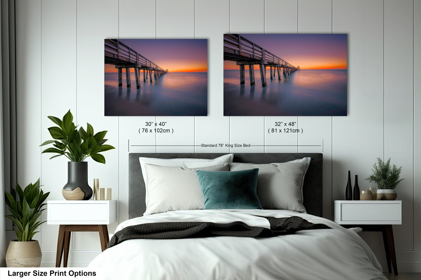 a bedroom with a bed and two pictures on the wall