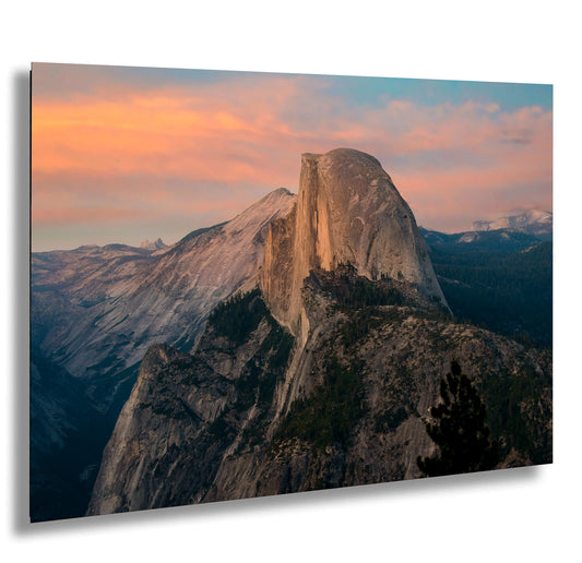 a view of the top of a mountain at sunset