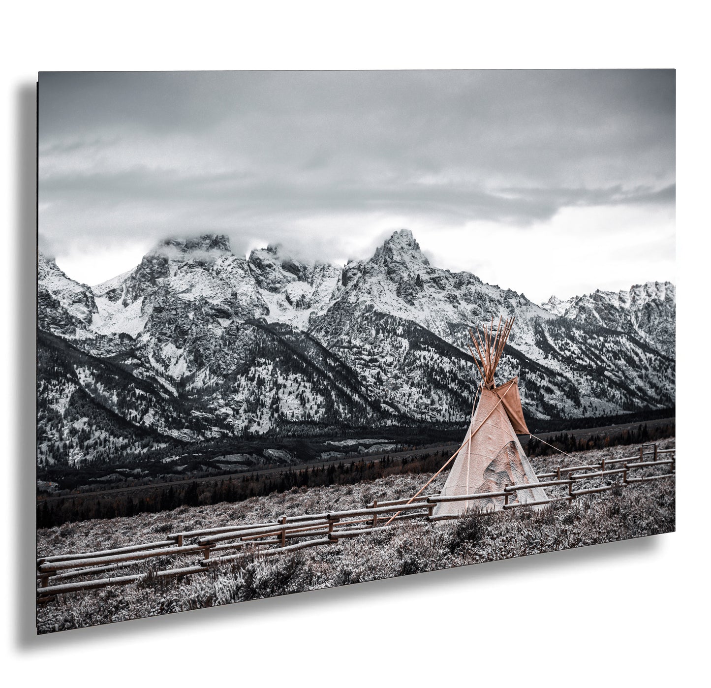 a woman standing in front of a mountain range