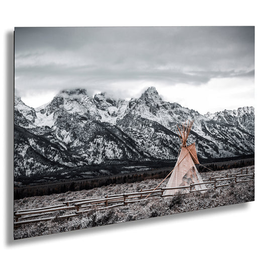 a woman standing in front of a mountain range