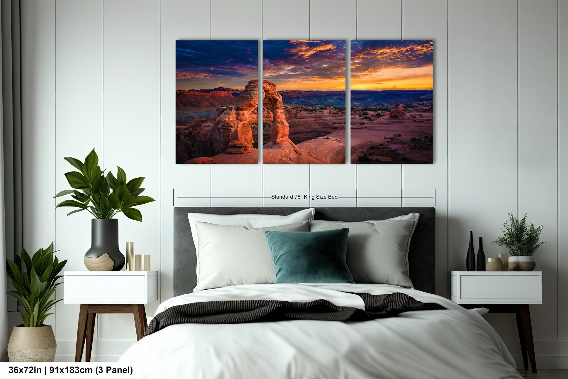 a bedroom with a bed and two paintings on the wall