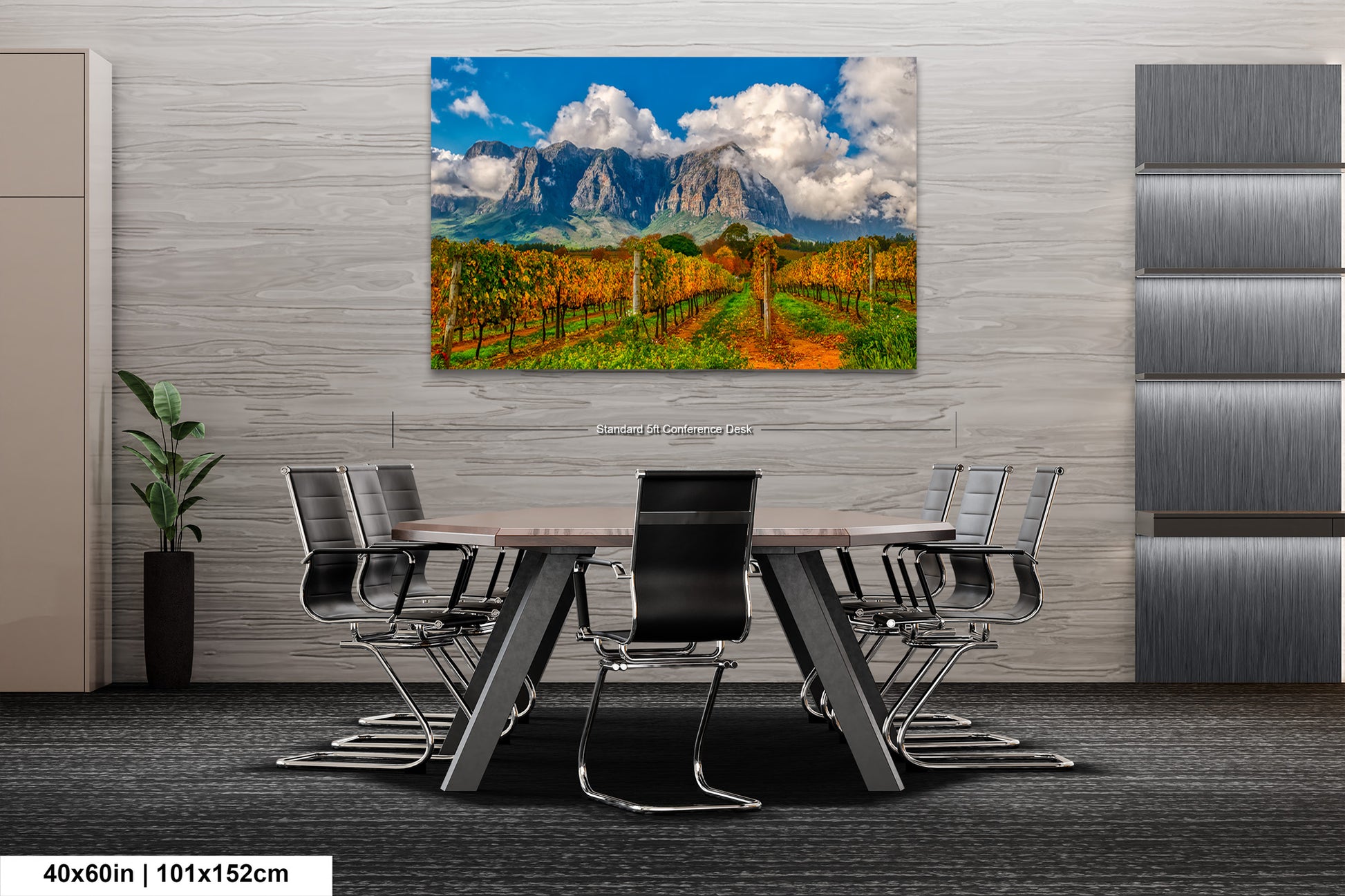a dining room table with chairs and a painting on the wall