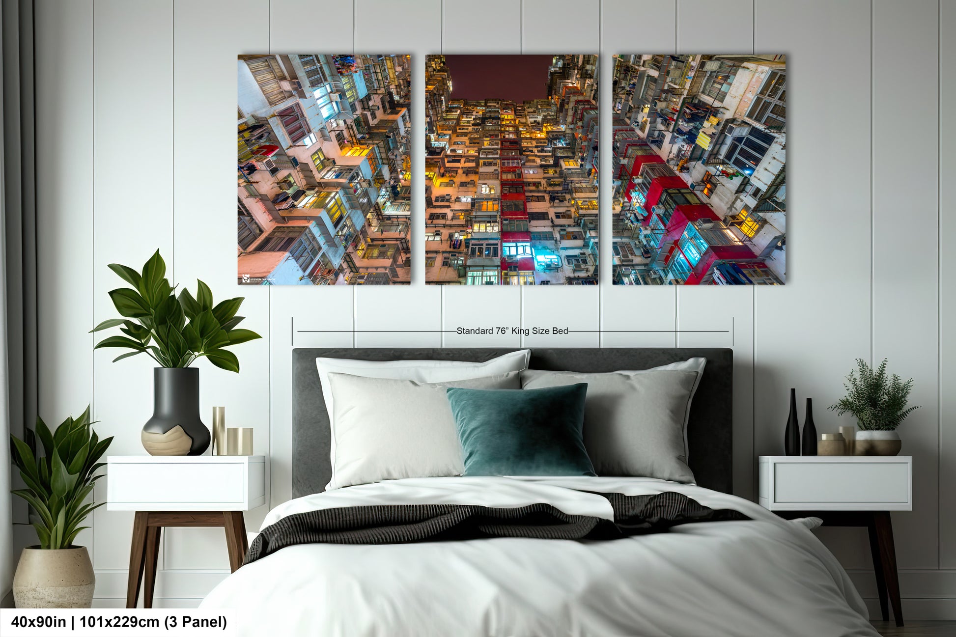 a bed room with a neatly made bed and two paintings on the wall