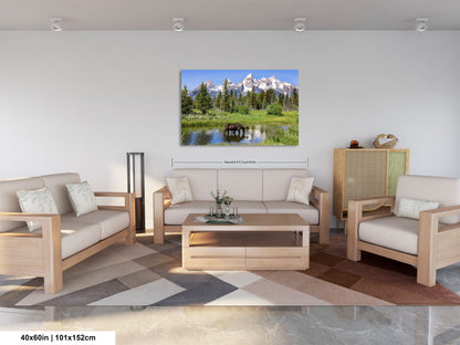 a living room filled with furniture and a painting on the wall