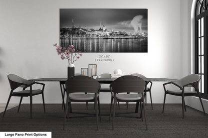 a black and white photo of a dining room table
