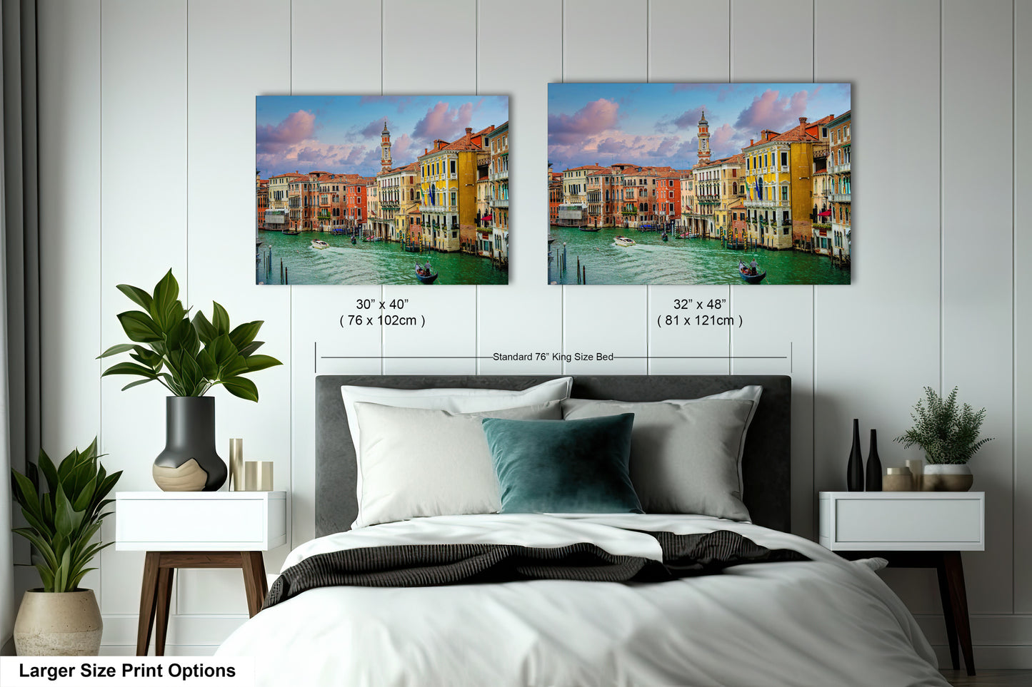 a bedroom with a bed and two pictures on the wall