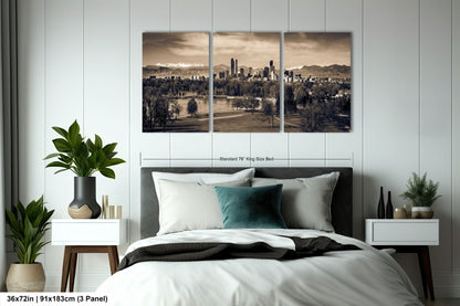 a bedroom with a large bed and two paintings on the wall
