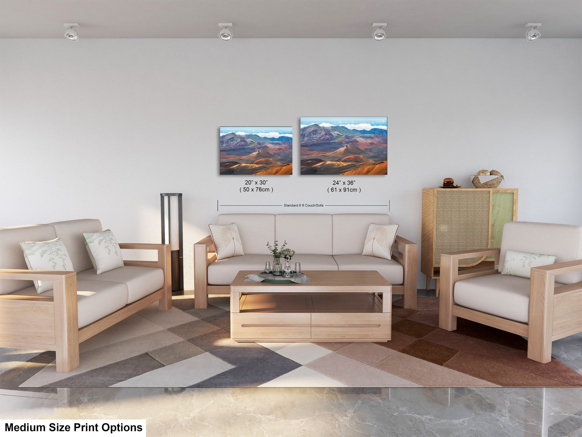 a modern living room with a white sofa, two chairs, and a coffee table. There are two framed landscape paintings hanging on the wall above the furniture.