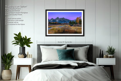 a bedroom with a bed and a painting on the wall