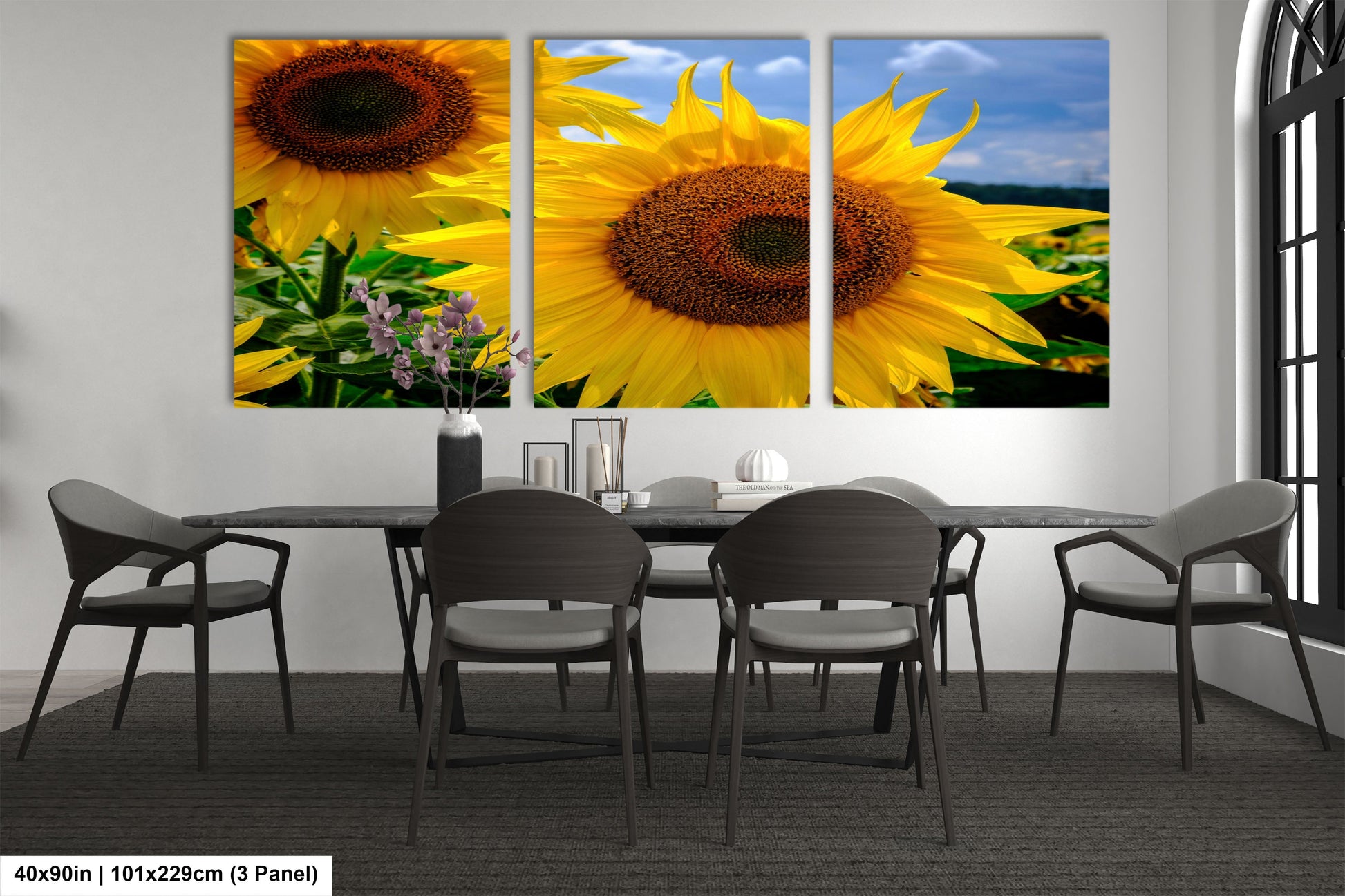 a dining room with a table and four sunflowers