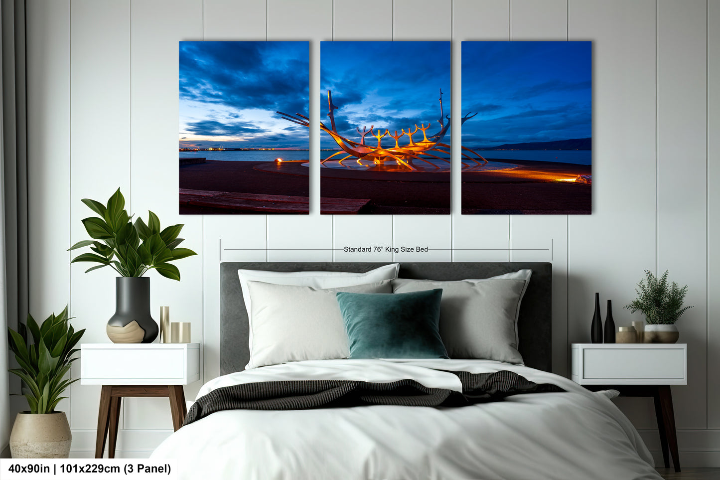 a bed room with a neatly made bed and three paintings on the wall