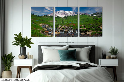 a bed room with a neatly made bed and two pictures on the wall