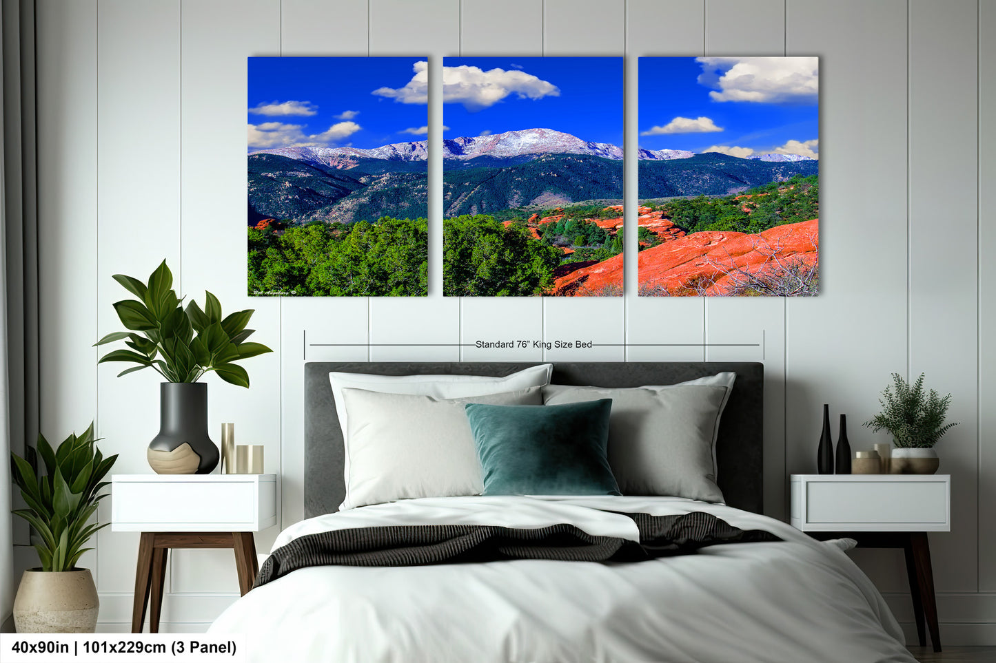 a bed room with a neatly made bed and three pictures on the wall