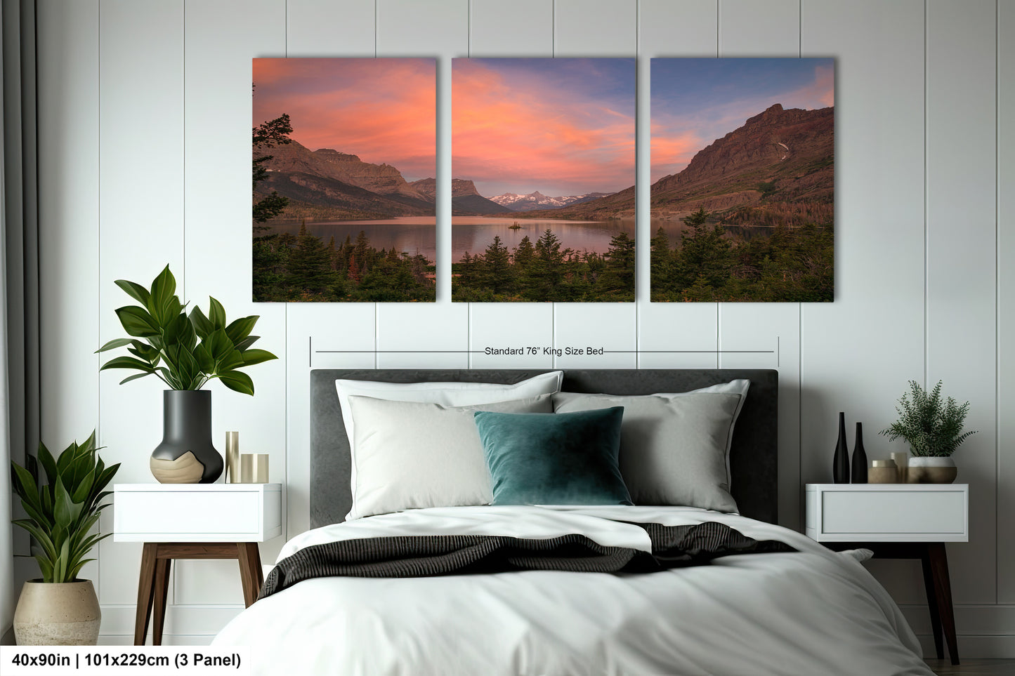 a bedroom with a bed and two paintings on the wall