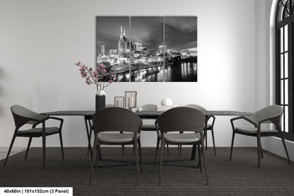 a black and white photo of a dining room table