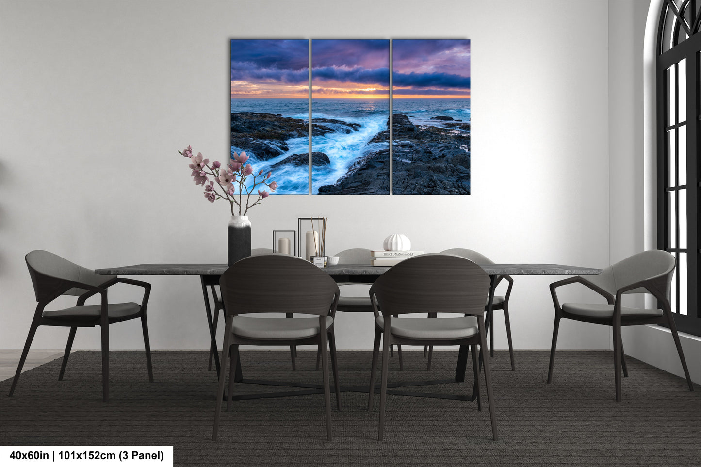 a dining room table with chairs and a painting on the wall