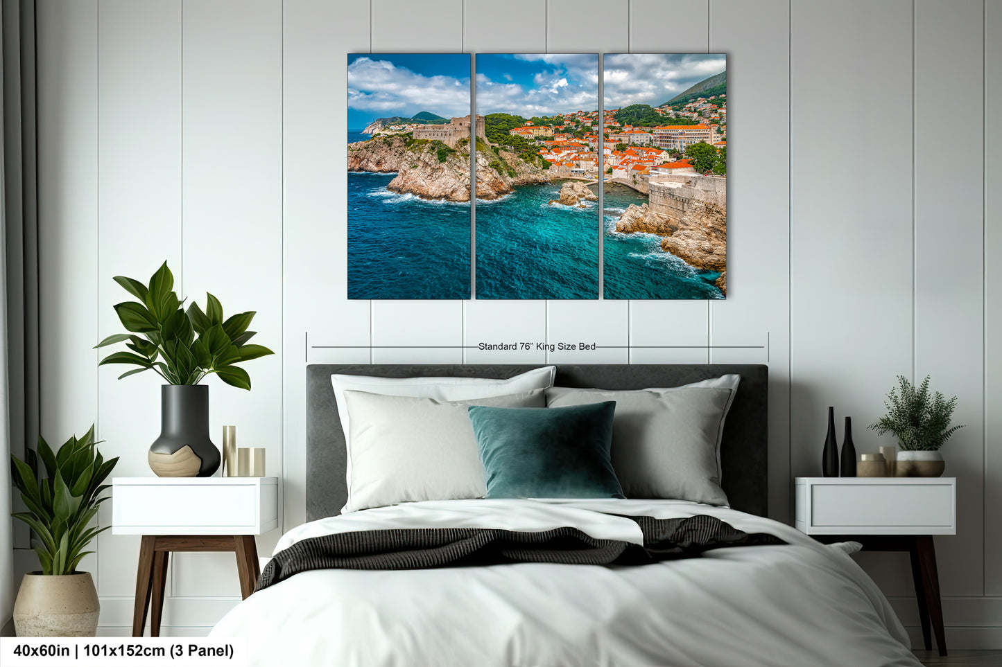 a bed room with a neatly made bed and a painting on the wall