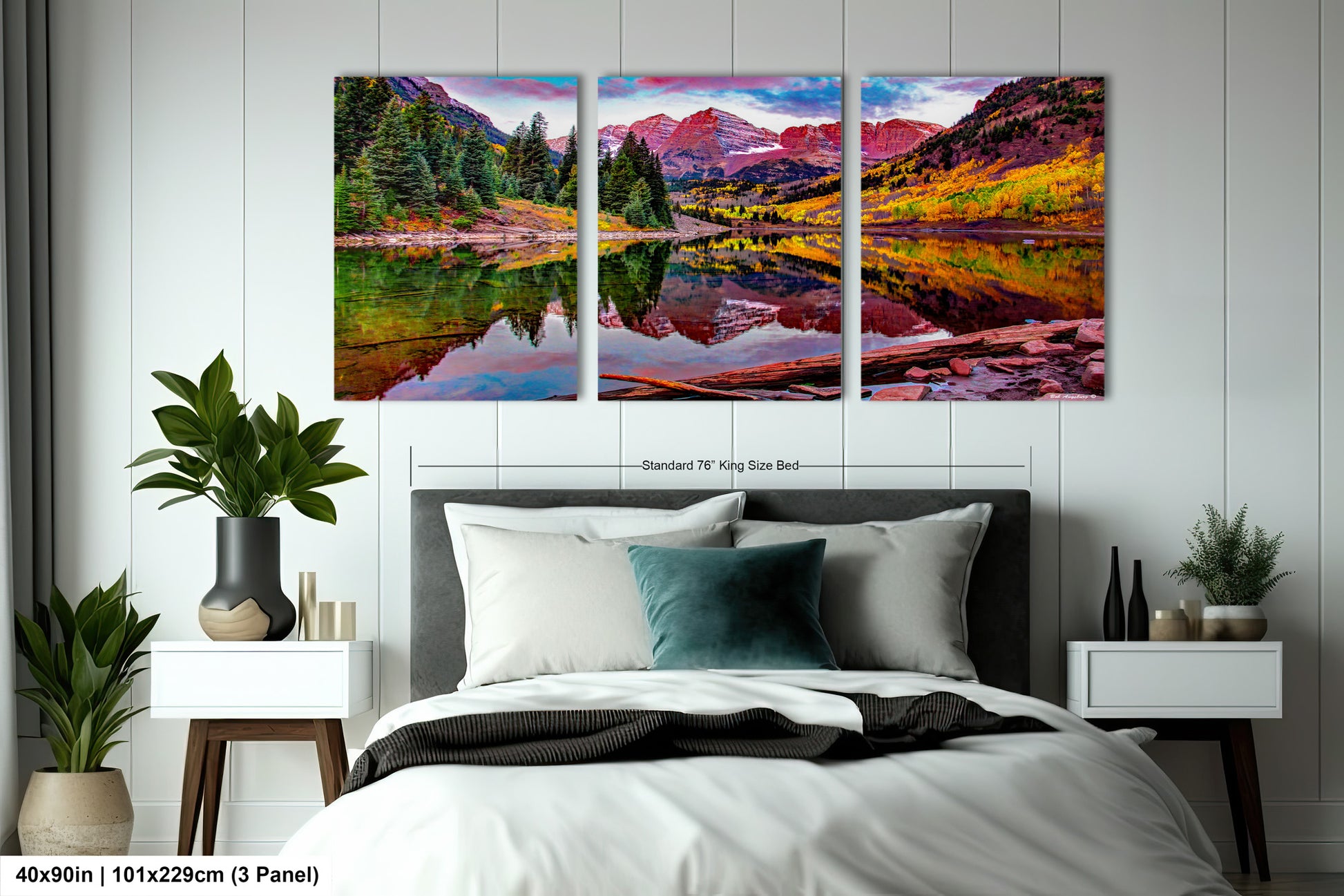 a bedroom with a bed and two paintings on the wall