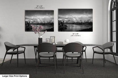 a black and white photo of a table and chairs