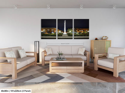 a living room filled with furniture and a painting on the wall